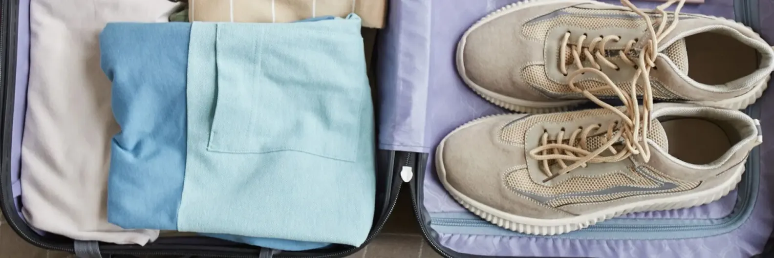 como dobrar roupas para economizar espaço na mala